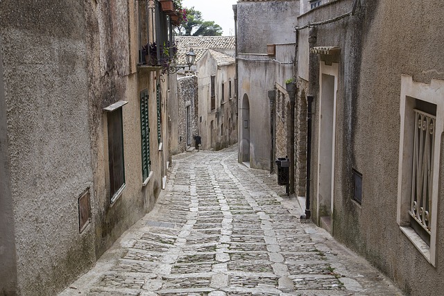 a cobblestone street in the medieval village of Erice, in Sicily, in the province of Trapani